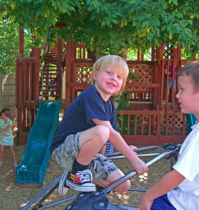 playgound-slide-show-2-boy-on-climber1-web-size - Newcastle School